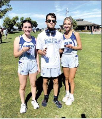 From left, Ivy Tullis, Logan Recoy and Ella Cool came home with medals from the Cozad cross country meet this past weekend. (Photo courtesy CPS)