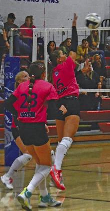 Kamryn Kramer (#6) plays the ball at the net in a triangular match on Oct. 6 in Arnold, as teammate Berklee Preston (#23) is ready to assist. (Courier photos by Ronda McFate)