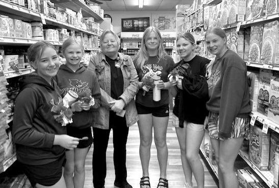 Members of the Callaway Junior American Legion Auxiliary helped distribute poppies made by veterans on Friday, May 26. The poppy distribution is an annual event held in conjunction with Memorial Day. (Photo courtesy Mary Ann Boldt)