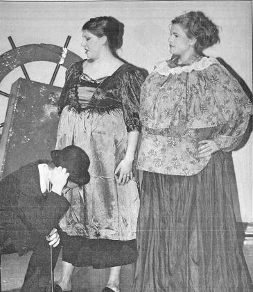This photo appeared in the Nov. 10, 2005, issue of the Courier. Performing in the Callaway High School production of “Phantom of the Op’ry”, opera critic Silky Acidtongue (Justin Geiser) bows before opera star Carotta Barracuda (Meredith Chesley) and Carotta's mom, Madame Barracuda (Cassidy Pitkin).
