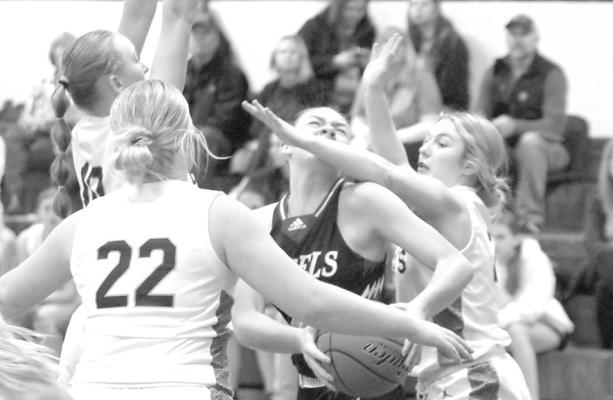 The Lady Bobcats put tough pressure on the Arcadia-Loup City ball handler. (Courier photo by Rhonda McFate)