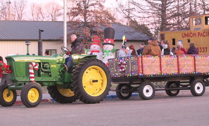 The tractor-drawn wagon rides around town are always a big hit at the Callaway Old Fashioned Christmas celebration. This year Darrell Fanholz had beautiful weather for driving his tractor.