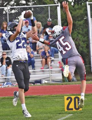 Jacob King (#22) makes the grab for South Loup on a 22 yard pass reception from Tysen Schacher Friday, Sept. 11, as the Bobcats defeated Hi-Line in Eustis. (Photo courtesy Barry Mraz)