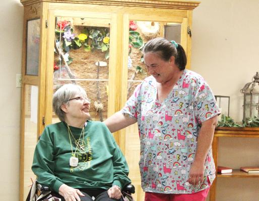 Joy Schaffert and Darci Barnes share a moment at the Callaway Good Life. (Courier photo by Ellen Mortensen)