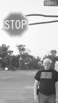 Charlie Jorgenson stands beside Callaway's new stop sign that he helped facilitate as a safety measure. (Courier photo by Loleta Connell)
