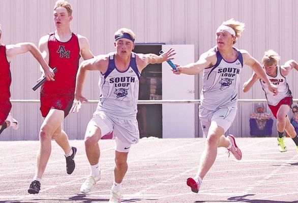 AJ Starr hands the baton to Ethan Furne as the 4x100 relay team ran their way to a gold medal in their home invite on May 9. (Courier photos by Ronda McFate)