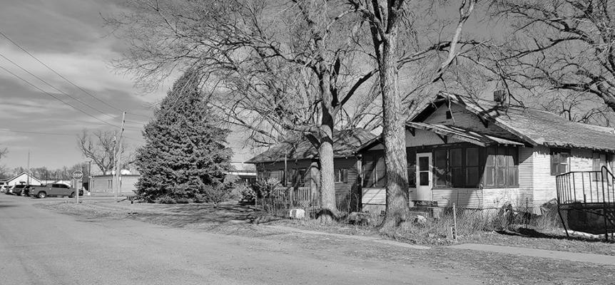 The two properties directly south of the school at 101 S Needham and 103 S Needham are owned by CPS, and a brief discussion exploring options for those properties took place at the Feb. 9 board meeting. (Courier photo by Ellen Mortensen)