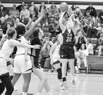 Josie Reiff (#20) hits a jump shot for 2 against the Twin Loup Wolves as the Lady Bobcats got the W in their opening game of the season. (Courier photo by Patti Schwarz)