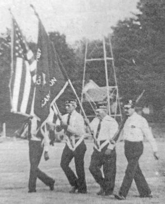 The Bryson Booker Post 59 color guard raised the flag last Friday at the Callaway-Arcadia football game. Shown from left are Robert Estergard, Wayne Witthuhn, Nigel Sprouse, and Sherman Hirsch. *This photo appeared in the Sept. 15, 1976, issue of the Callaway Courier.