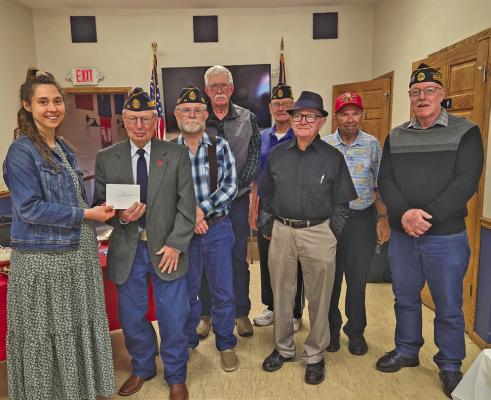ALA President Cora Belew presents a check to American Legion Post 59 Commander Dale Estergard representing the post. (Photos courtesy Jo Chesley)
