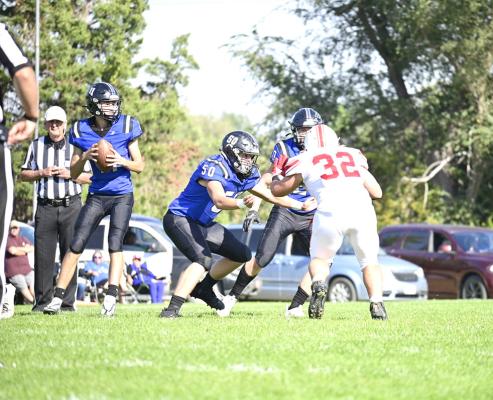 Conner Paulsen bulls his way through the line for extra yardage as the Bobcats took on Sandhills Valley last week. South Loup came out on top of the high scoring, hard-fought contest. (Courier photo by Jessica Tickle)