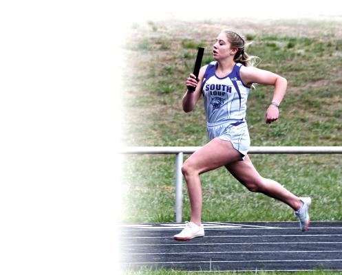 Erin Fitzgerald helps the Lady Bobcats to a 3rd place finish (4:31.12) in the 1600m relay. (Courier photos by Loleta Connell)