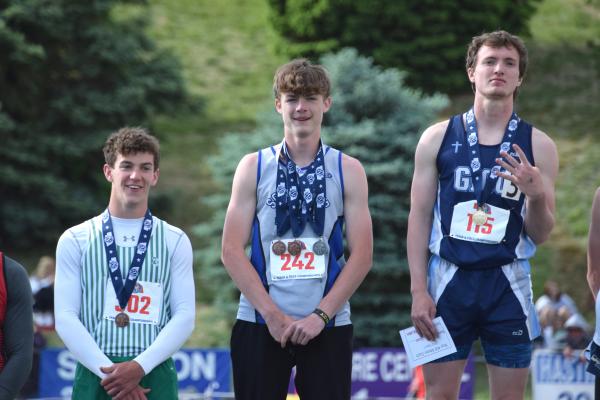 Cache Gracey stands podium with third-place honors in the Class C 400 meters. (Courier photo by Loleta Connell)