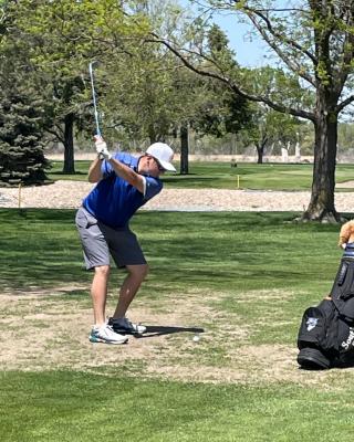 Colbi Smith eyes his shot in district action last week at Rivers’ Edge. Smith played at the NSAA State Golf Championships on May 16. (Courier file photo)