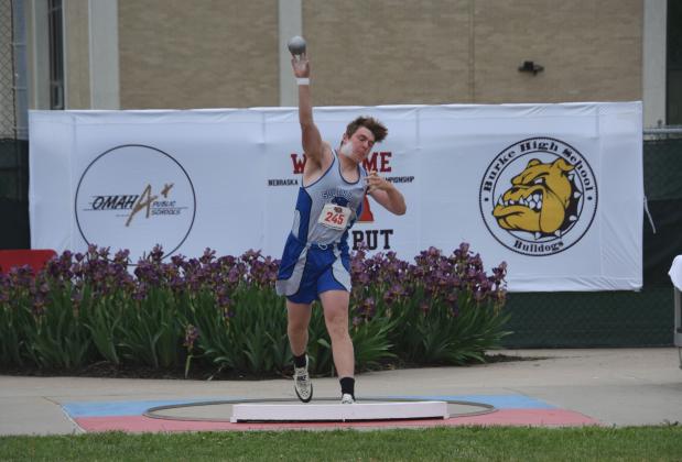 Rio Remund gives the shot put a mighty heave. (Courier photo by Loleta Connell)
