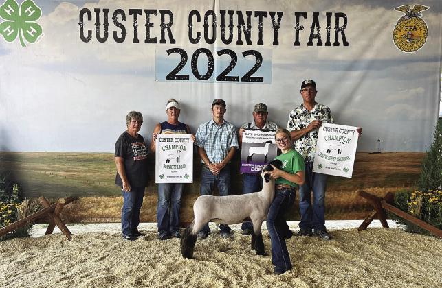 Abby Stallbaumer Champion Sr Showmanship and Elite Showmanship Sheep division winner. Champion 4-H Market lamb.