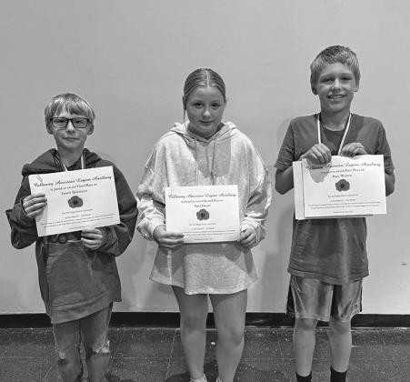 Fifth grade winners in the poster contest were, from left: Emmit Quitmeyer, third place; Piper Hoesel, second place; and Pryce Warren, first place.