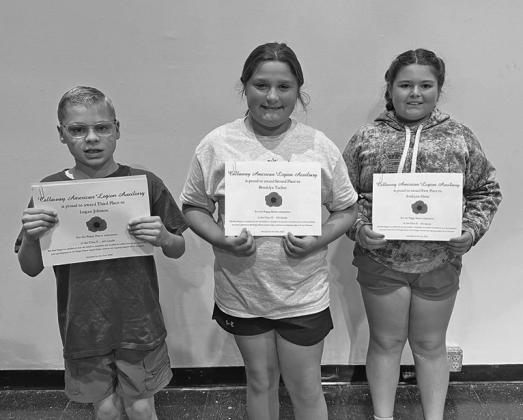 Fourth grade winners in the poster contest were, from left: Logan Johnson, third place; Brooklyn Tucker, second place; and AvaLynn Ortiz, first place.