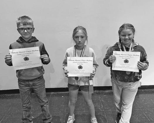 Third grade winners in the poster contest were, from left: Taygan Boeser, third place; Kaylee Berg, second place; and Rayna Blackburn, first place.