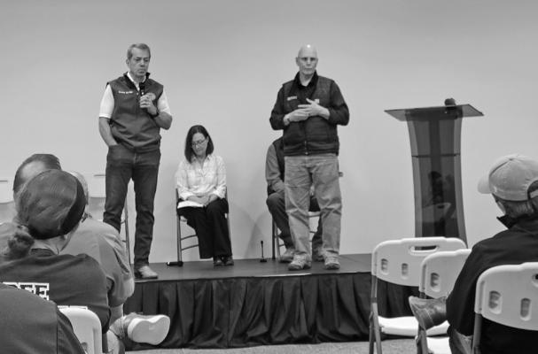 From left: Gov. Jim Pillen, NDA Director Sherry Vinton, and NEMA Assistant Director Erv Portis addressed a crowd of firefighters, landowners, and the concerned public with an update on the Cottonwood Fire and help available to those affected by its devastation. (Photo by Ellen Mortensen)