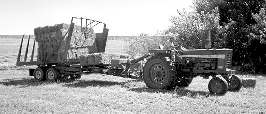 Jake Fairley has fond memories of his dad pulling the New Holland stack wagon for small square bales back on the family dairy farm of his childhood. (Photo courtesy Jake Fairley)