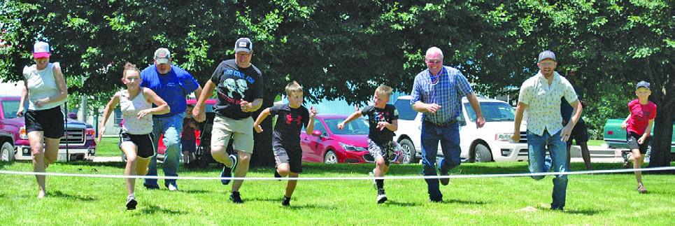 Despite the heat, there were several participants in the games at Oconto Fun Days. Here, participants sprint for the finish line in a foot race.