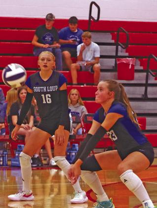 Berklee Preston (#23) concentrates as she prepares to return a ball during the Brady triangular last week, while teammate Addison Dalrymple (#16) looks on. (Courier photos by Ronda McFate)