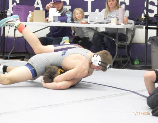CJ Quandt works on pinning his opponent at the Garden County Invite last week, where he won the silver medal in his weight class. (Courier photo by Brandy Mason)