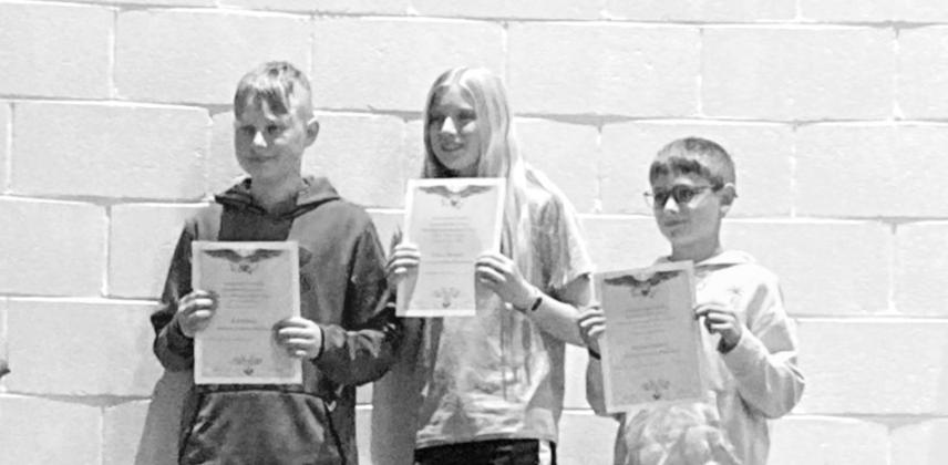 6th grade Americanism essay winners, from left: 1st Remi Flynn, 2nd Gracie Brennan and 3rd Stetson Guthrie. Lynch.