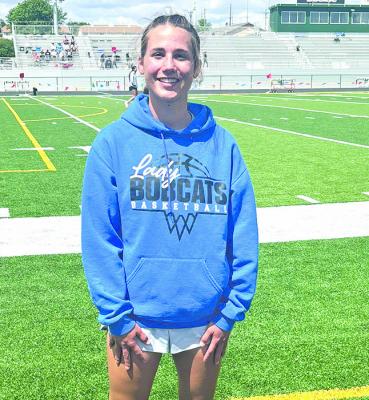 LEFT: EvaLynn Wonch punched her ticket to Omaha and won the district silver medal in the discus.