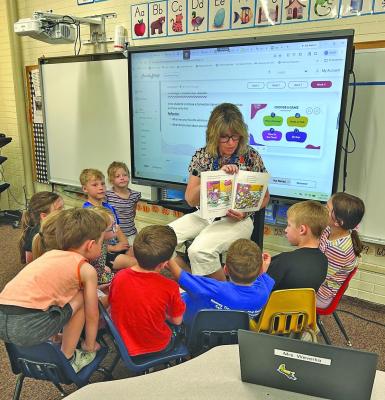 Resource teacher Karen Weverka reads a lesson from the Character Strong curriculum to a group of young Callaway Public School students. New sensory materials purchased with grant funds are helping keep students more focused and engaged in the classroom. (Photo courtesy Stephanie Ross) THIS SPACE LEFT BLANK FOR MAILING LABEL