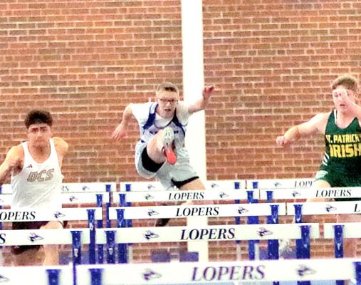 Caleb McFate, center, finished in 5th place in the 60m hurdles in Kearney last week in the first meet of his senior track season. (Courier photo by Ronda McFate)