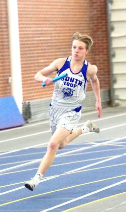 Senior Dawson Mason flies around the track during his leg of the boys 4x400m relay. The Bobcats earned a 4th place medal in the race. (Courier photo by Ronda McFate)