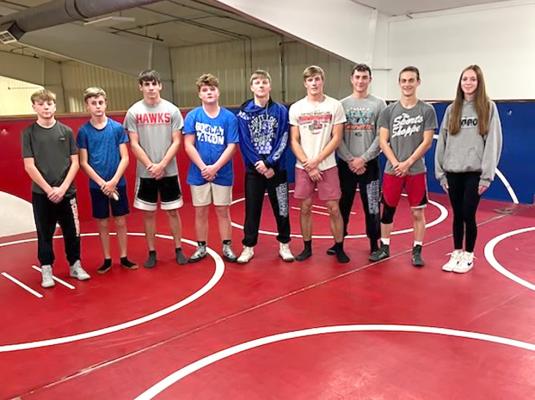 Members of the 2024-25 South Loup Bobcats wrestling team are, from left, student manager Cruz Mason, Noah Hiatt, Ryan Lords, Zane Ellision, Dawson Mason, CJ Quandt, Paxton Bierman, Josiah Coleman, and student manger Josie Lehmkuler (Photo courtesy CPS)