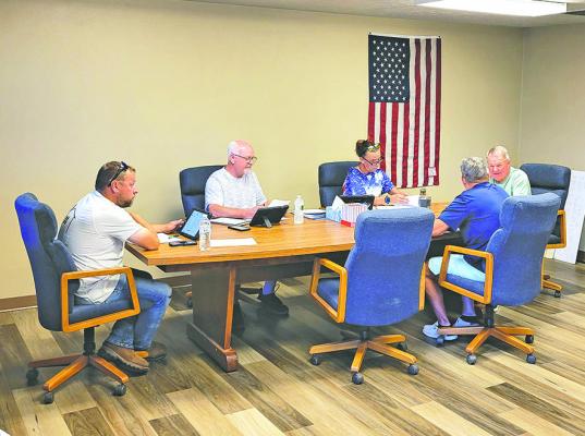 The Callaway Village Board listened to a proposed idea from the school board regarding future expansion of the school during their August board meeting, but took no action. From left are TJ Elliott, Lawrence Paulsen, Village Clerk Lori Bonde, Mark Kimball, and Darwin Mast. Dan Lewandowski was not present for the meeting. (Courier photo by Ellen Mortensen)