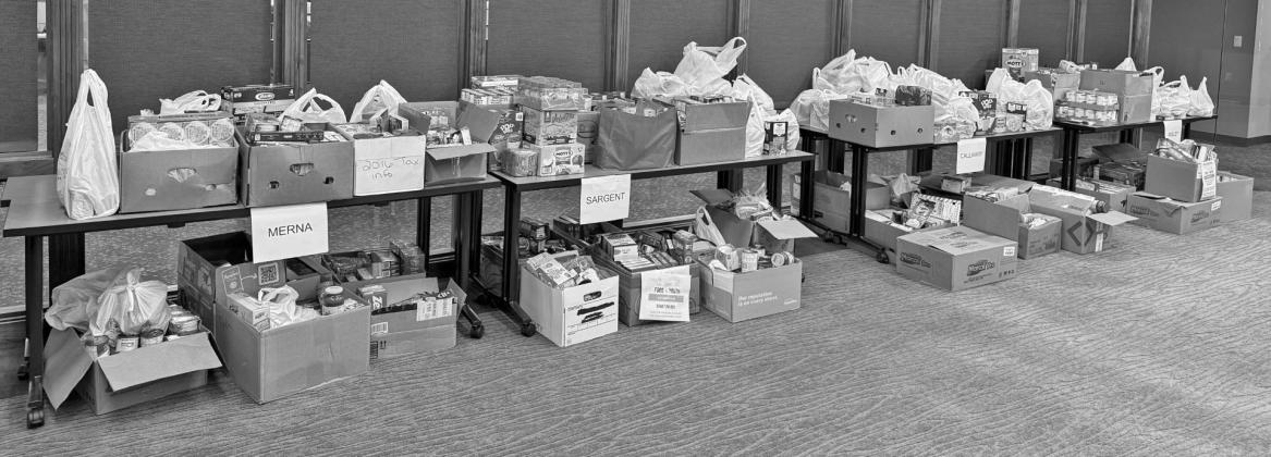 Pictured is a portion of the 4,371 snacks and meal donations from last year’s challenge being sorted for Custer County backpack programs and food pantries. (Photo courtesy CC Foundation)