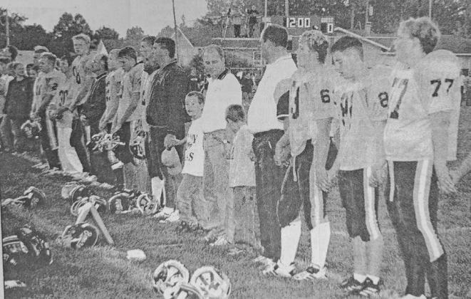Players, coaches, and fans circled the field at Arnold to hold hands and honor the flag and remember the victims of the terrorist attack on New York City and Washington, D.C. A football contest between the Callaway Bears and the Arnold Cardinals went as scheduled a short time later.