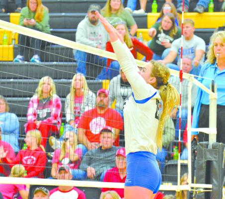 Bryn Schwarz puts up a block for the Lady Bobcats against Anselmo- Merna at the MNAC tournament. (Courier photos by Patti Schwarz)