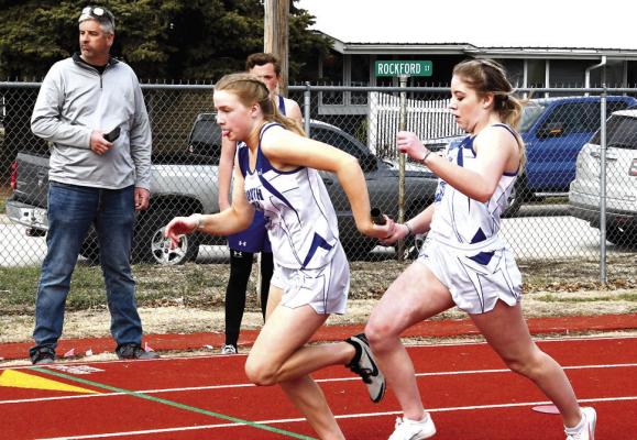 Erin Fitzgerald hands off to Joslyn Reiff for the second leg of the girls 4x100 relay finishing 1st at 54.73 with Charli Vickers and Halie Recoy.