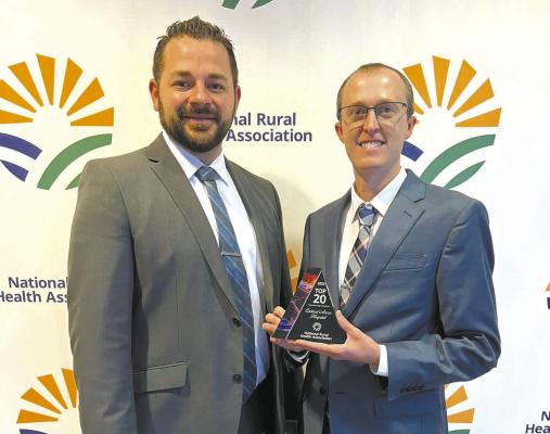 Callaway District Hospital &amp; Medical Clinics CEO Brett Eggleston, right, holds the award for being named one of the nation’s Top 20 Critical Access Hospitals. He was joined in accepting the award by former hospital CFO Caleb Poore at the presentation in Kansas City in September. (Courtesy photo)