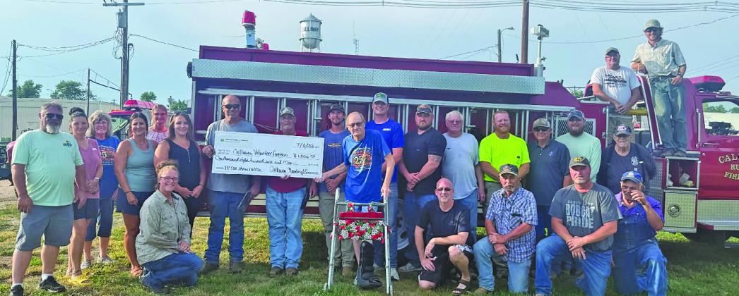 A check for just over $1,800 was presented to the Callaway Volunteer Fire Department on July 6, from funds raised during the Pioneer Picnic Car Show. After five years of coordinating the event Lee Bruns (pictured center with the walker) is stepping down. Chamber board members, pictured left of the check, joined members of the CVFD, pictured right, for the presentation. (Courtesy photo)