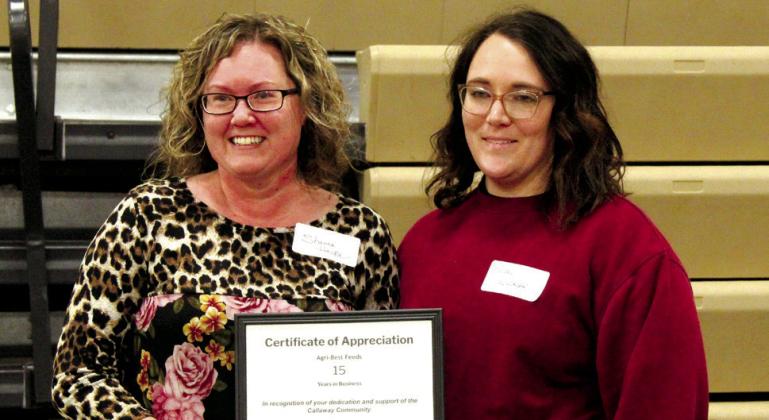 Accepting a certificate for 15 years in business on behalf of Agri-Best Feeds is Shanna Haidle. Presenting the award on behalf of the Callaway Chamber is board secretary Kelsey Wyckoff, who accepted the 10-year award on behalf of Trumbull Repair and Auto. (Courier photos by Ellen Mortensen)