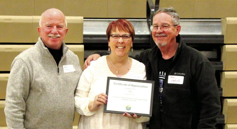 The Callaway Courier was recognized for 55 years of providing news and information to the community. Accepting the certificate from Chamber President Ken Pitkin, left, is Courier/Syndicate Publishing Editor Ellen Mortensen and long-time owner/publisher of the Courier, Michael Wendorff.