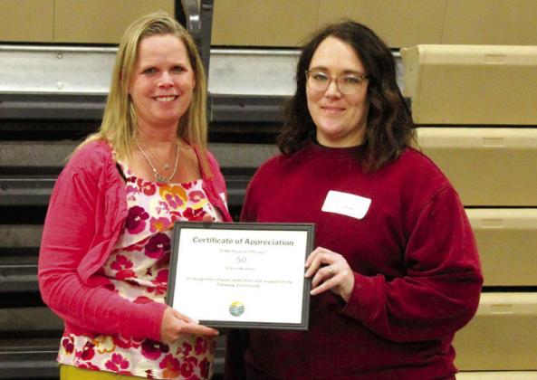 Mary Ross, left, is co-owner of TEAM Physical Therapy and accepted the certificate for 50 years of serving Callaway from Chamber board member Kelsey Wyckoff.