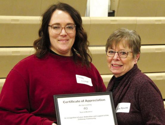 Judy Meredith, right, was recognized for 40 years of business in Callaway with J&amp;J Accounting. Presenting her certificate is Kelsey Wyckoff.