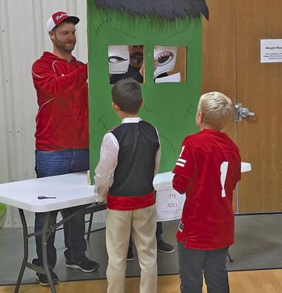 Brian Hogg of 4 County Heating &amp; Air manned one of the game booths.