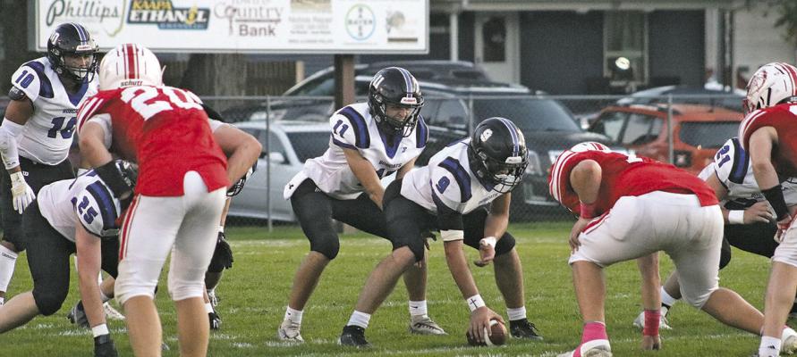 Dylan Pandorf (#11) waits for the snap from his center, Paxton Bierman, as the Bobcats took on Pleasanton on the road on Oct. 2. Also pictured are Conner Paulsen (#10), Malachi Neth (#25) and Noah Anderson (#21). (Courier photo by Melissa Eggleston)