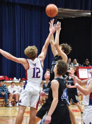 Freshman Dylan Pandorf shoots for two against the Raiders Friday evening.