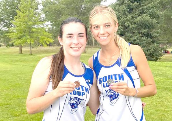 Ivy Tullis, left, and Ella Cool continue to pick up hardware for the South Loup cross country team. (Photos courtesy CPS)