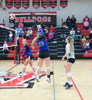 Bryn Schwarz passes the ball to Ainsworth during the Bobcat's final regular season game last Tuesday. The Bobcats won 3-1. Photo by Amanda Wehnes